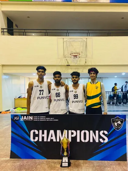 Posing behind the "Champions" banner at The Sports Forum.