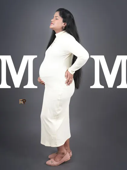 A powerful and modern statement. The word "MOM" frames the mom-to-be, celebrating her new identity in a bold, graphic style.
