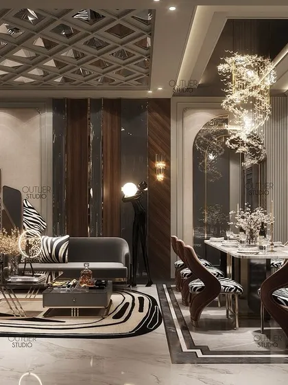 We welcome you to a world of luxury with this living and dining space. A mesmerizing chandelier hangs over the double-height dining area, while modern furniture and zebra-print accents add a contemporary and playful touch.
