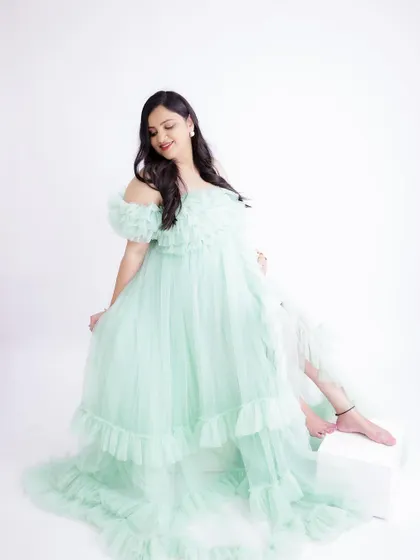 A duplicate of image 107, this light and airy portrait in a mint green gown is sweet and delicate.