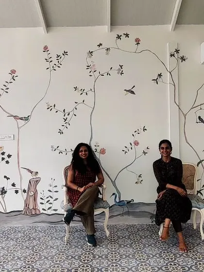 A duplicate image of my partner and me in front of the mural.