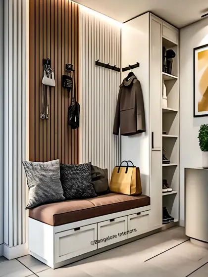 We designed this entryway to be both welcoming and highly organized. The unit features a comfortable seating bench with pull-out drawers for storage, hooks for coats and bags, and a dedicated shoe cabinet, ensuring a tidy and functional first impression.