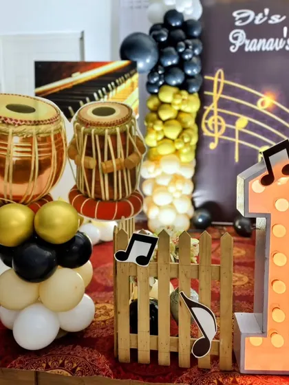 A detail shot of the tabla balloon props and light-up number '1'.