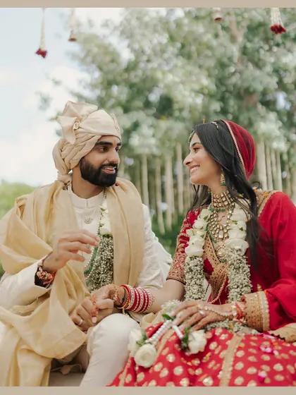 Nikita and Rishabh share a look of love and laughter during their Udaipur ceremony. Capturing these candid interactions is key to telling an authentic love story.