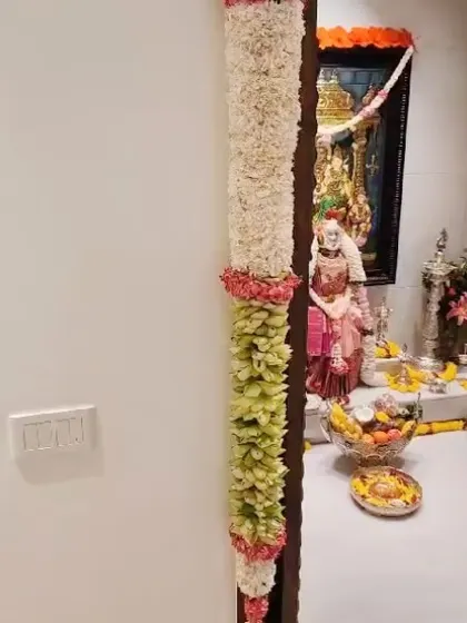 Varamahalakshmi habba shubhashayagalu. For the festival, I created this beautiful door decoration, or 'tomale', using traditional flowers and leaves to welcome the goddess into the home.