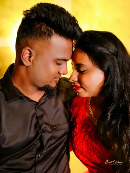A close and intimate pre-wedding portrait. The warm lighting and genuine smiles make this a truly heartfelt image.
