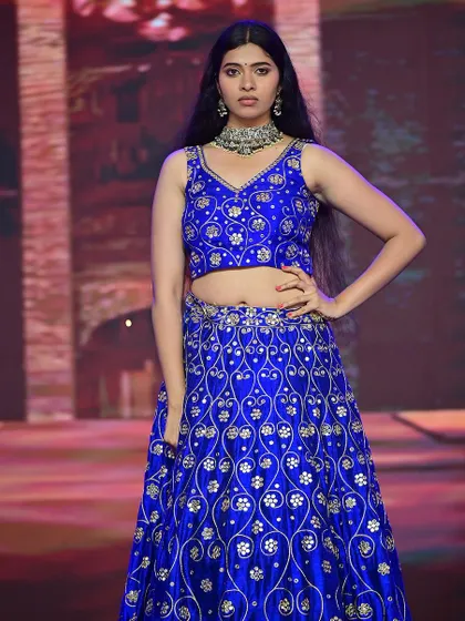 Another runway shot, demonstrating how the makeup looks under different stage lighting, remaining consistent and impactful.