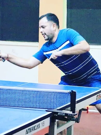 We also have a strong group of adult and corporate players. This action shot shows one of our adult players, Shubham, competing in a corporate table tennis tournament.