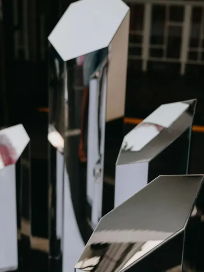 Geometric mirror pillars that guests could interact with, reflecting the crazy lights and energy of the after-party.