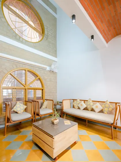 The living room 옆, showing the play of light and the simple elegance of the furniture.