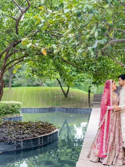 A romantic photo of the couple surrounded by nature.