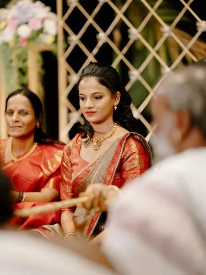A candid shot during the engagement ceremony. The makeup is natural and allows her expressions to shine.