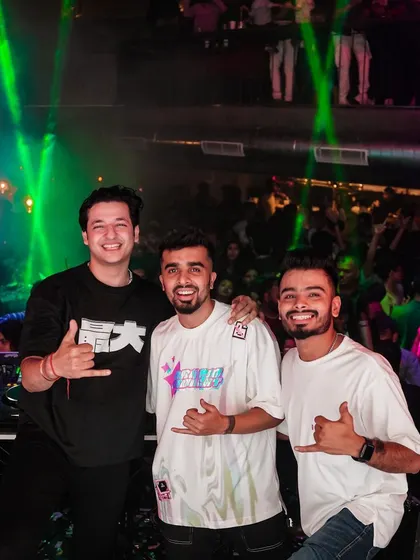 Three DJs united on stage, all smiles. A great photo showing the camaraderie and talent in the Bangalore DJ scene.