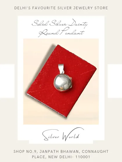 A simple and classic solid silver round locket pendant. This timeless piece is perfect for keeping a small photo or memento close to your heart.