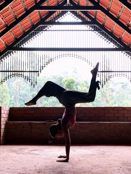 Finding my balance in a handstand inside this beautiful shala in Coorg. The architecture and the forest outside create such a magical space for practice.