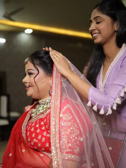 My talented assistant ensuring the bride's veil is perfectly placed and secure before she walks down the aisle.