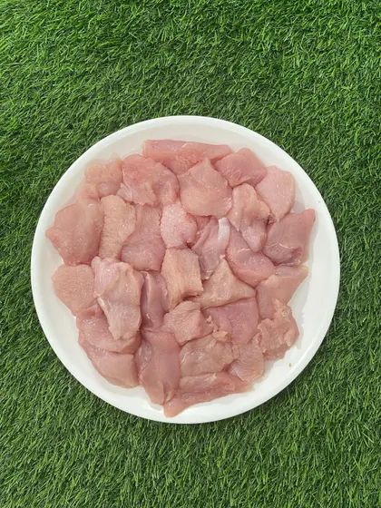 Freshly cubed Turkey Boneless meat, ready for packing. This lean protein is a great alternative for pets with poultry sensitivities.