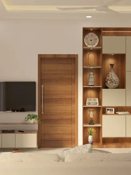 A TV unit and display cabinet from the Yelahanka project. The design uses a combination of open and closed storage, with integrated lighting to highlight decorative items.