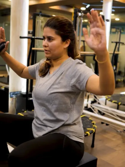 Every session is customized for your body. This client is focusing on her form during an upper body exercise, building strength at her own pace with my guidance.