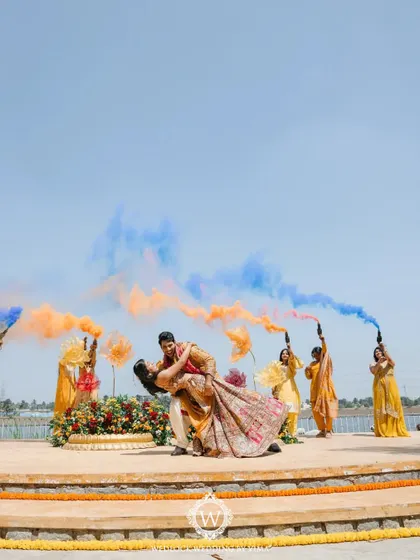 This Haldi ceremony was a burst of color and unforgettable moments. We used vibrant tissue flowers, playful origami birds, and colorful smoke bombs to bring the venue to life.