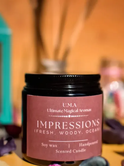 A single 'Impressions' candle. The combination of fresh, woody, and ocean notes is both grounding and uplifting.