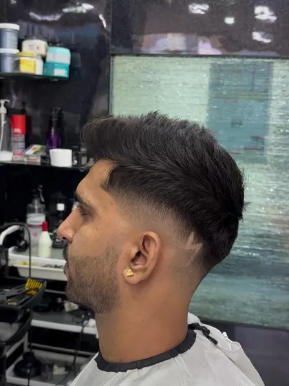The back view of a fade with a V-shape design at the neckline.
