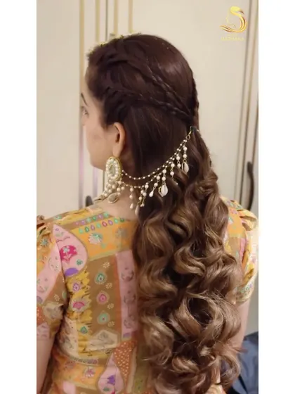 A side view of the Haldi look, showcasing the pretty hair accessory that connects to the earring.