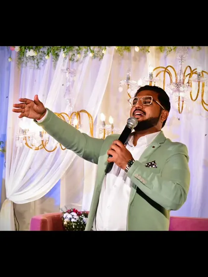 Sharing joy is what I do best. An expressive shot of me hosting an event.