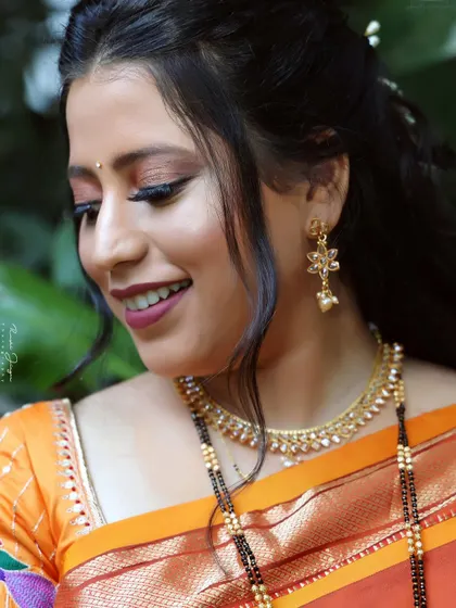 A close-up of a subtle bridal look. The focus is on glowing skin and soft, romantic eye makeup that enhances her natural beauty.