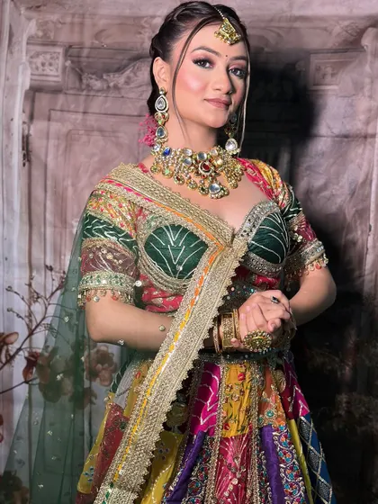 Another angle of the multi-color lehenga, showing the intricate embroidery on the green blouse.