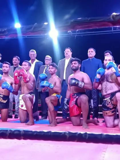 The pro fighters taking a knee in a traditional sign of respect before the competition.