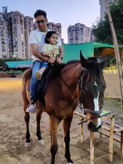 We love creating unforgettable family moments. Here, a father enjoys a safe and gentle ride with his young daughter, showing that horse riding can be a joy for all ages.