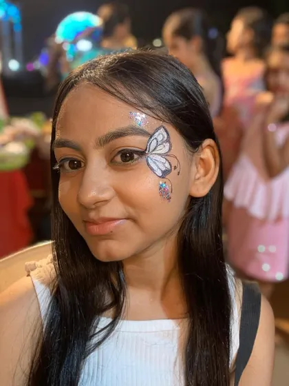 A full-face view of the elegant white butterfly design.