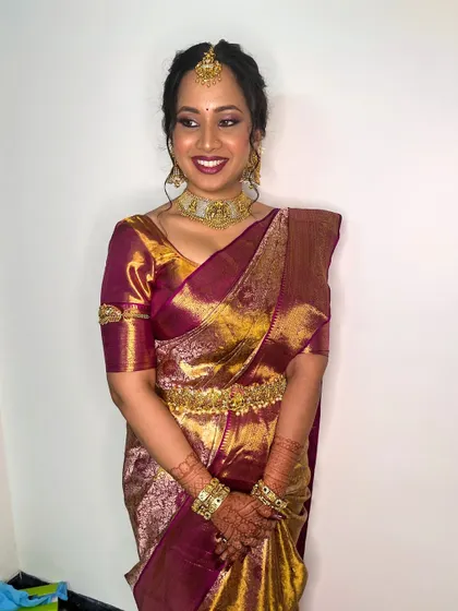 The full look, showing how the makeup complements the rich colors of the Kanjivaram saree and the intricate temple jewelry.