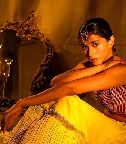 A close-up from the Nayantaara campaign, highlighting the traditional headpiece and warm, bronzed makeup. The look is both regal and intimate.