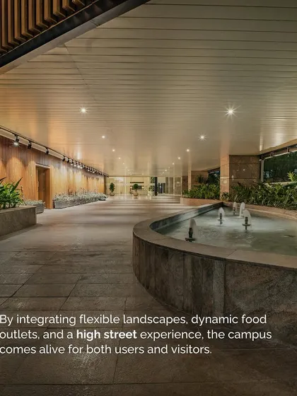 A water feature flows through the public plaza at V Park, creating a soothing ambiance. This space is designed to be a "high street" experience, coming alive with dynamic food outlets and flexible landscapes for both users and visitors.