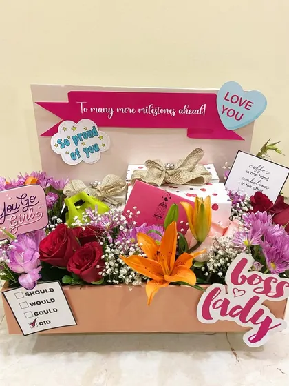 For the 'Boss Lady' mom, this hamper is a celebration of her achievements. It's filled with vibrant flowers and fun, encouraging messages to show how proud you are.
