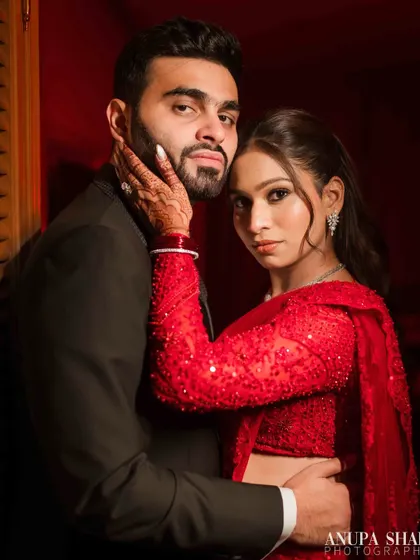A bold and dramatic reception portrait. Using colored lighting, I created this moody, high-fashion look that shows a different, spicier side of the couple's personality.