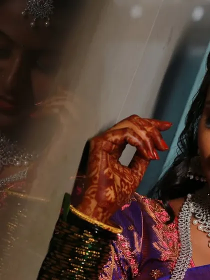 An artistic bridal portrait with a reflection, adding depth and a creative touch to the shot.