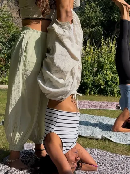 Supporting a student in Sirsasana, or headstand. Inversions are a wonderful way to shift perspective, and I am always there to offer a helping hand and ensure you feel safe as you explore them.