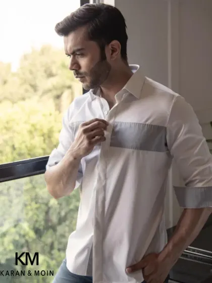 Another view of the color-blocked shirt, showing the detail on the cuffs. It's a versatile piece that provides a crisp look with effortless style.
