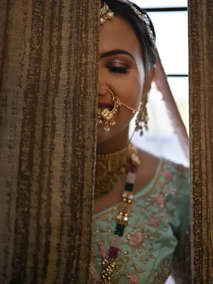 An artistic close-up showing the beautiful purple-toned smokey eye, a modern twist on a bridal look.