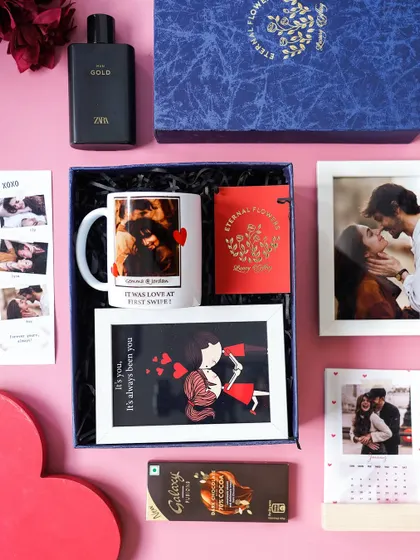 An overhead view of the 'Sweetheart's Delight' hamper being packed, showing the careful arrangement of each personalized gift.