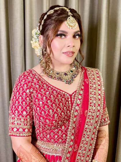 A close-up portrait focusing on her face, showing the soft contour and glowing highlight.