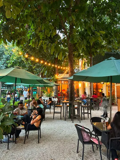 The patio at dusk, with guests enjoying the transition from day to night.