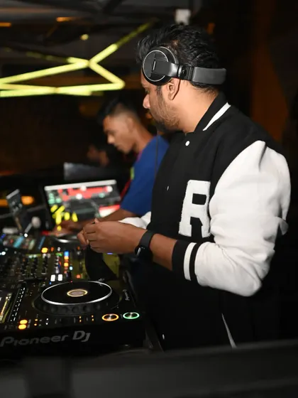 Focused on the decks, I'm constantly working to blend tracks smoothly and keep the energy flowing.