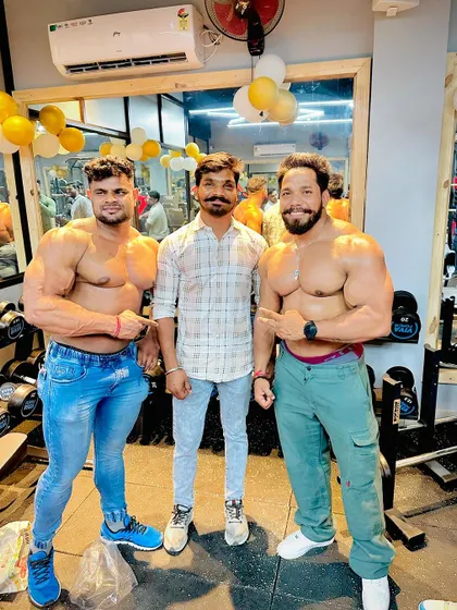 Posing with friends and supporters at the gym.