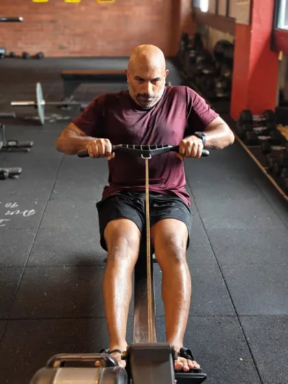 Locked in and focused. These shots capture the intensity and determination of our members during their workouts, from band work and deadlifts to dumbbell presses and rowing.