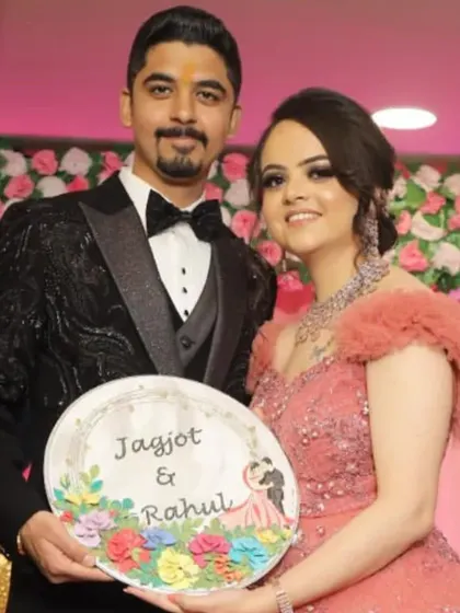 The happy couple, Jagjot and Rahul, holding their custom nameplate on their engagement day. It brings me so much joy to see my art become part of such special moments.