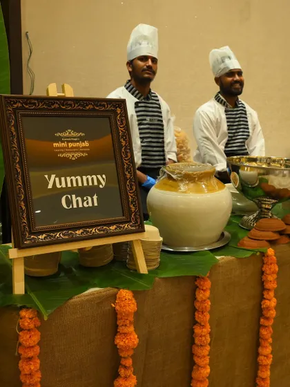 Our Yummy Chat counter is a celebration of India's favourite street food. With chefs ready to serve, this station, decorated with banana leaves and marigolds, brings authentic and hygienic chaat to your event.